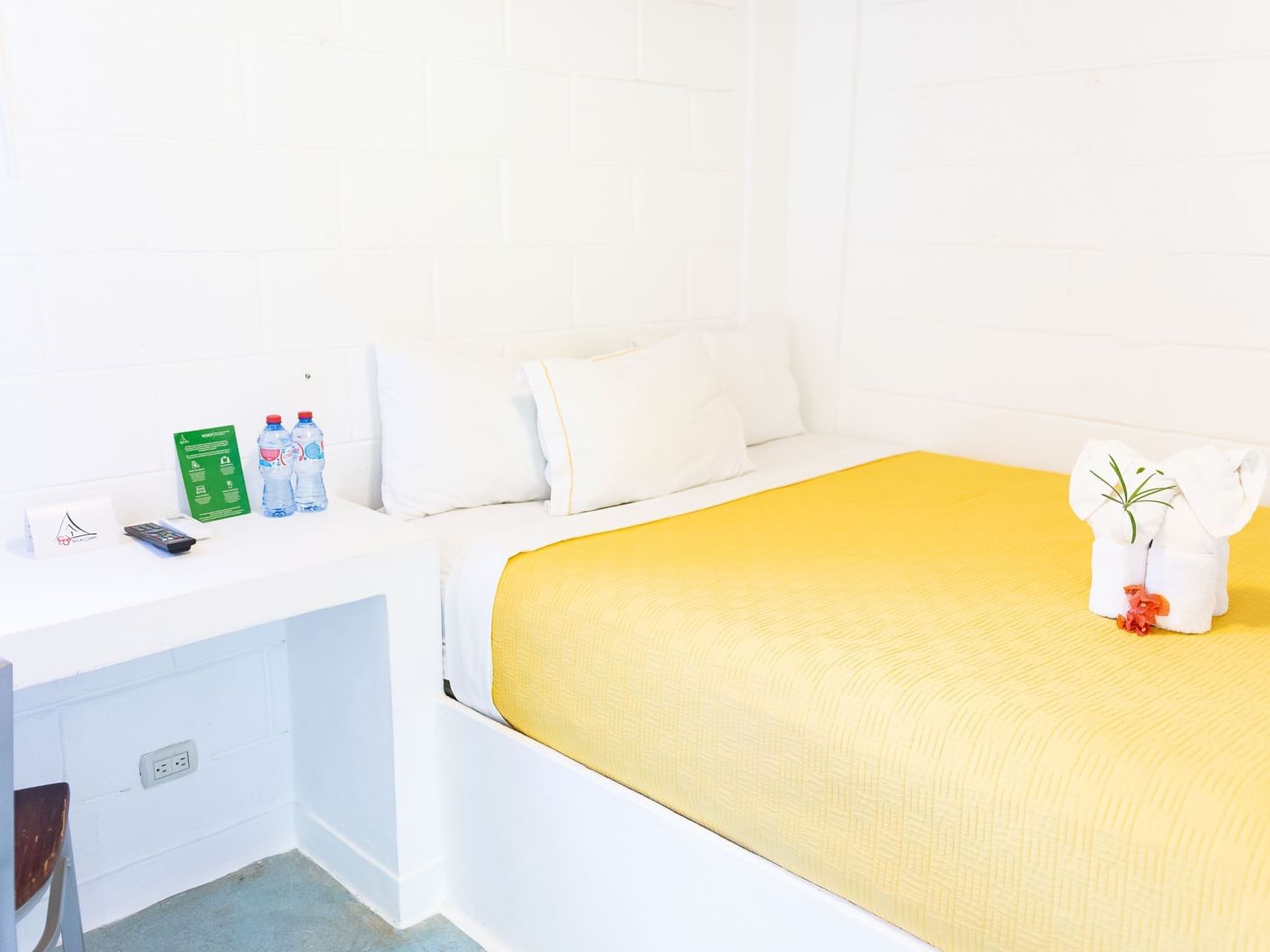 Interior view of a room with a single bed and working desk at Villas Codevi