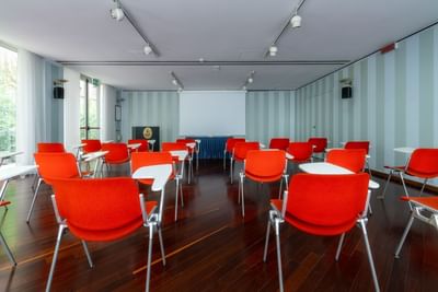 Spacious chair set up with screen  in Meeting Room at Hotel Crivi's in Milan