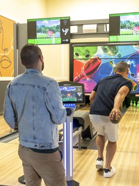 Friends gathered for a Duckpin bowling activity at Cove Pocono Resorts