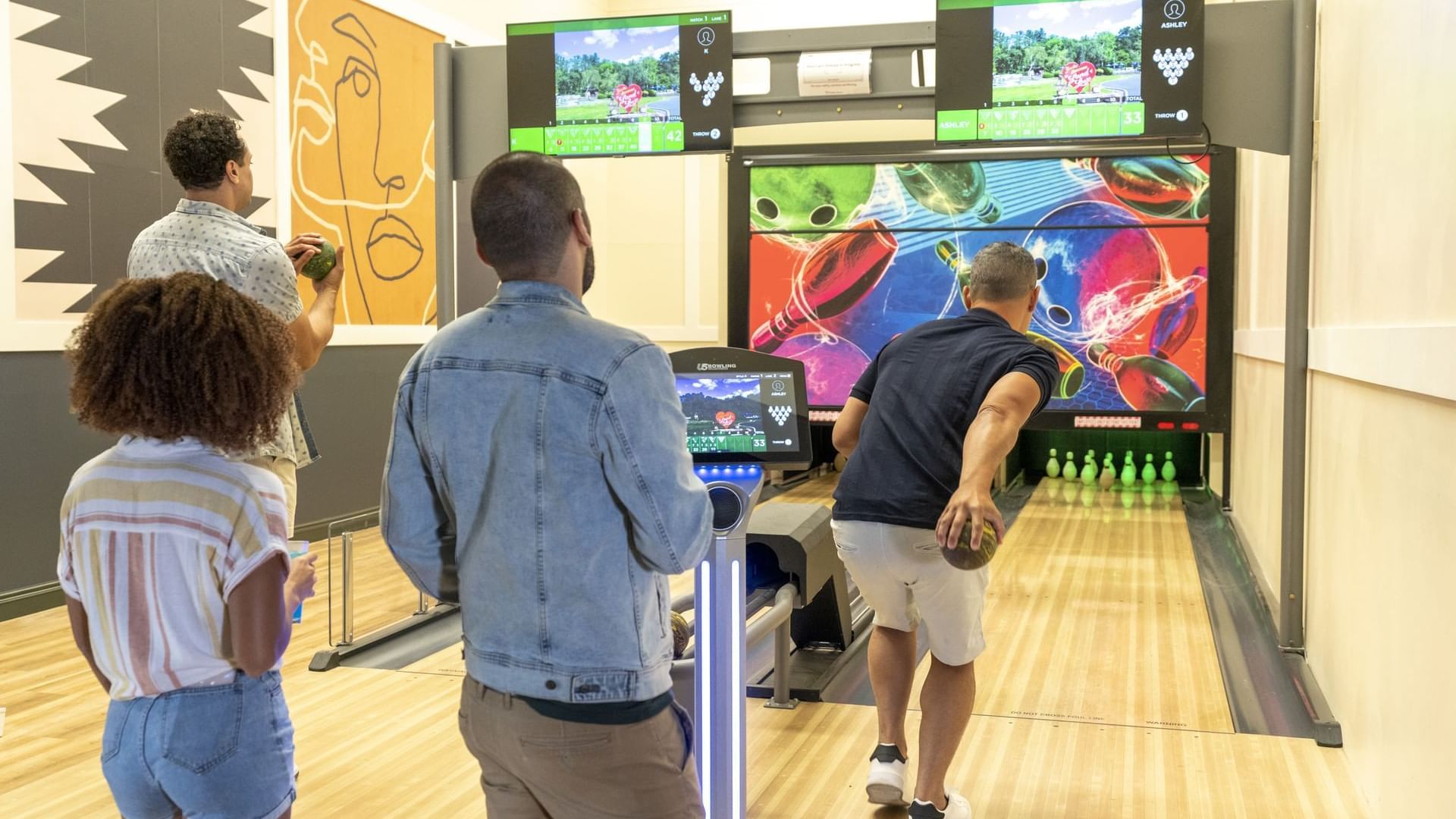 Friends gathered for a Duckpin bowling activity at Cove Pocono Resorts