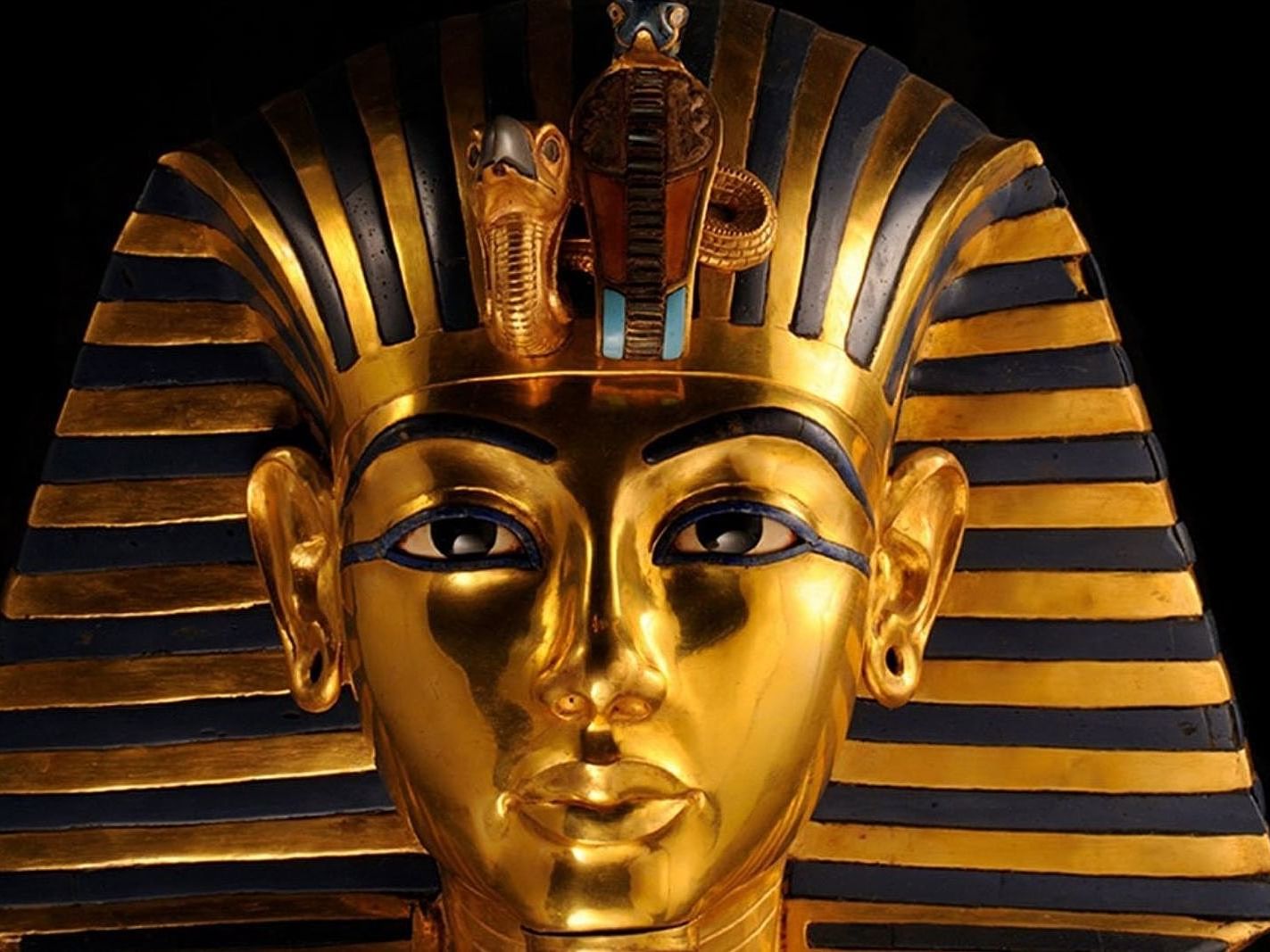 A gold and blue enamel mask of King Tut