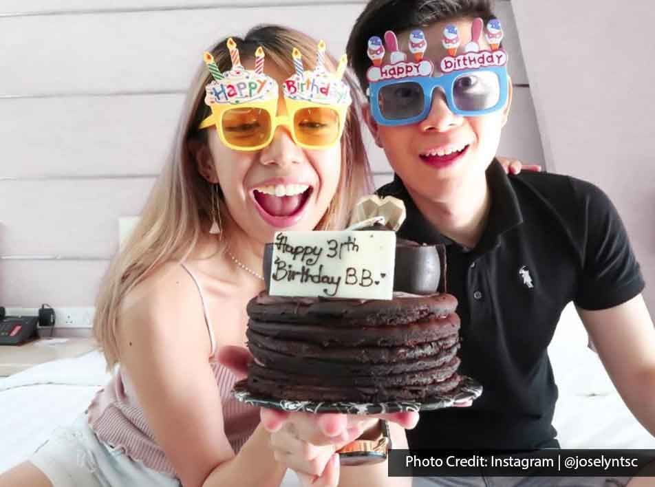 young couple celebrating birthday together in Lexis Hotel