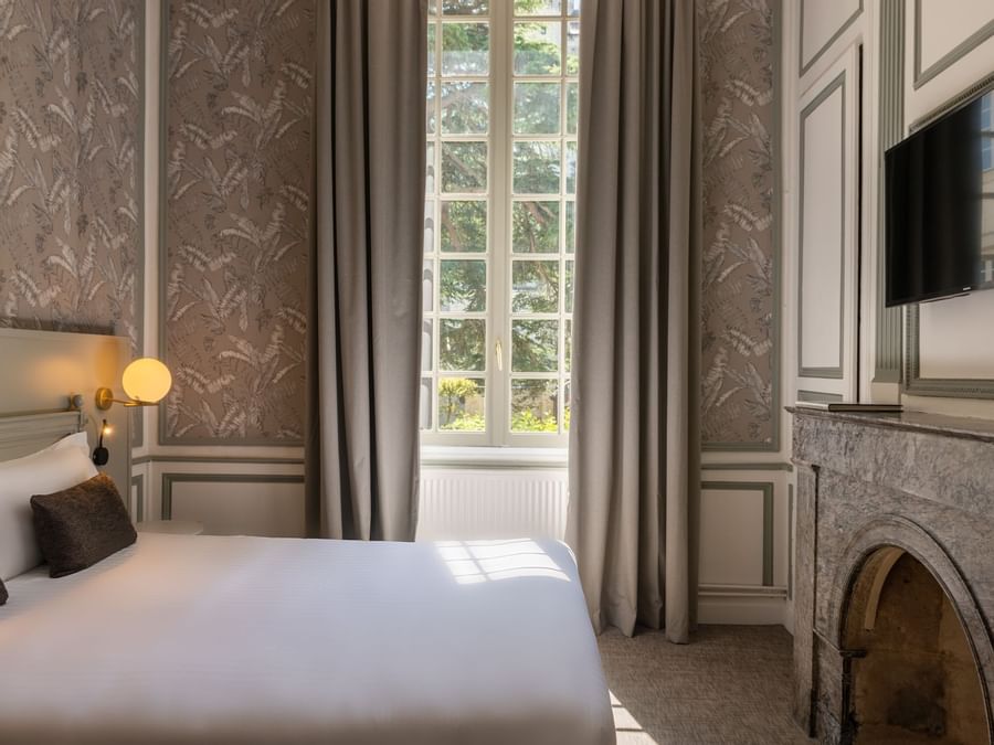 Double bed in chambre classique at The Originals Hotels