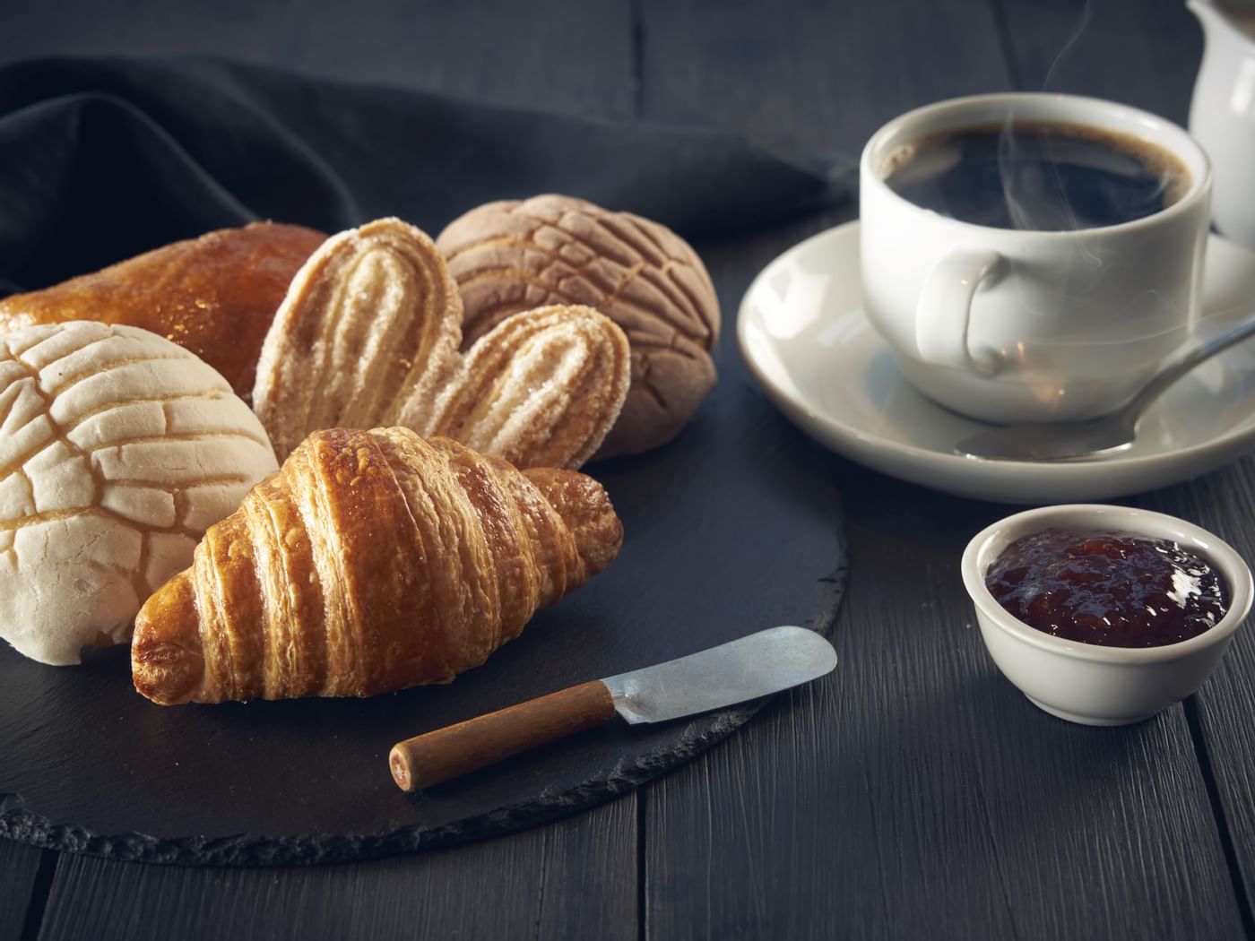 Pan dulce with black coffee & jam served at Fiesta Inn