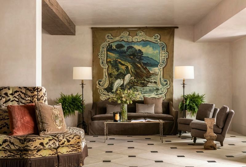 Elegant lobby at Granduca Houston, one of the top Houston luxury hotels, featuring circular seating and fine art decor