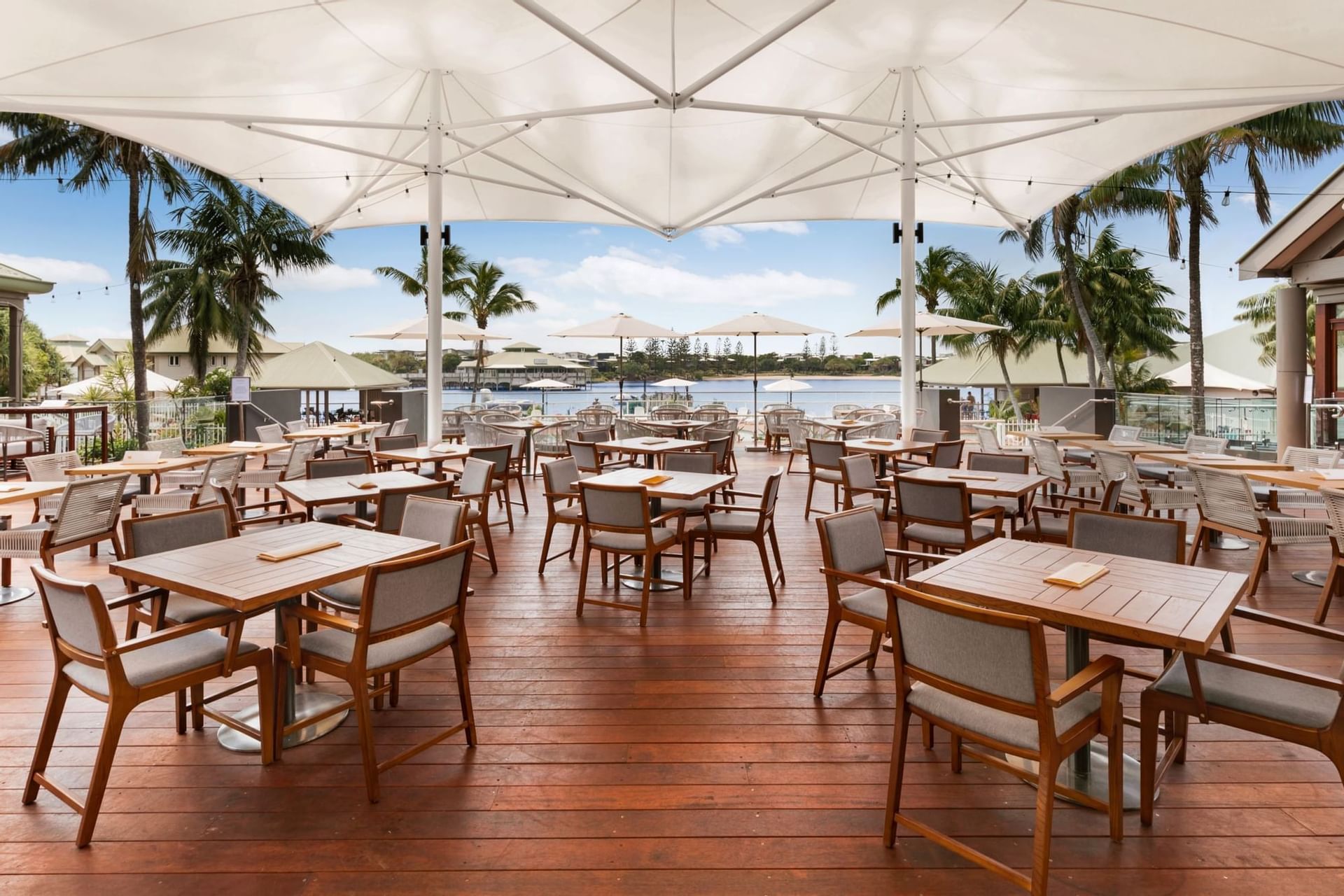 Dining area next to pool in Novotel Sunshine Coast Resort 