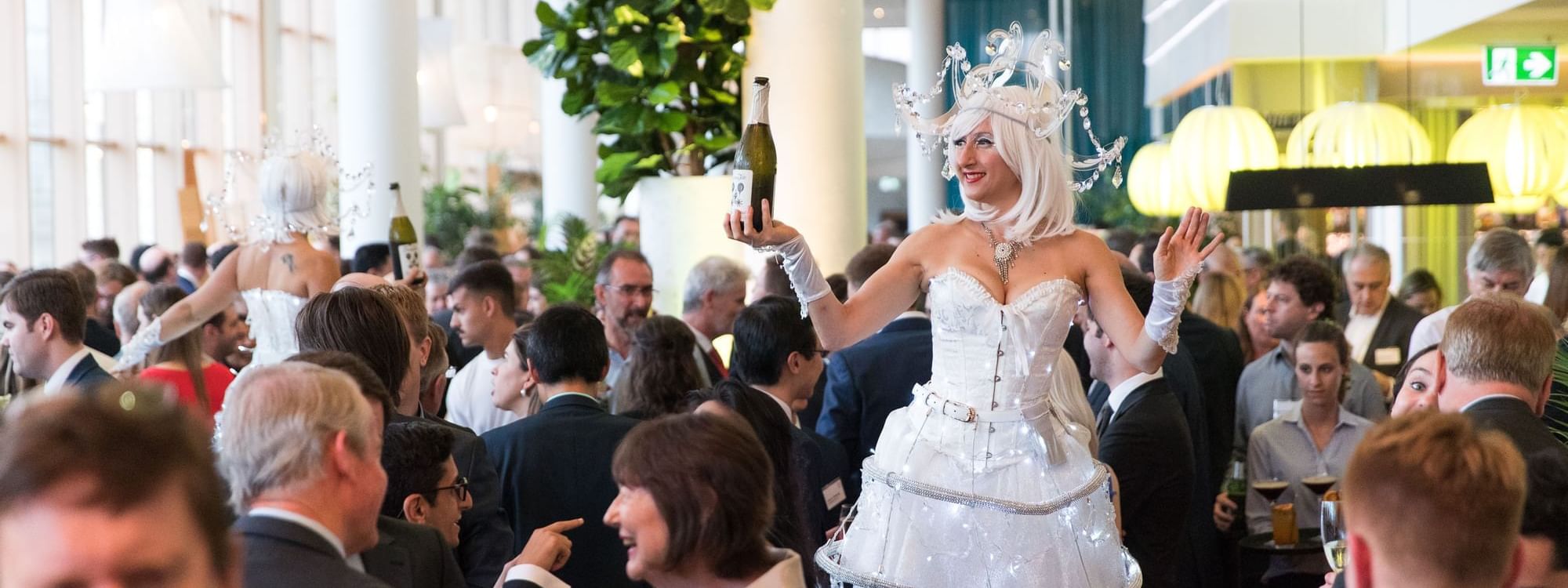 Event with woman in an illuminated costume serving drinks in The Ternary at Novotel Sydney on Darling Harbour