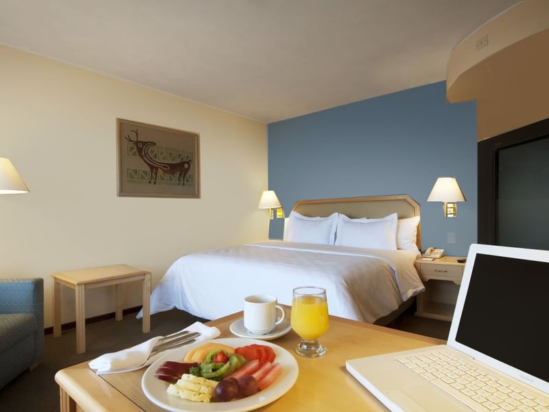 Fruit plate served with drinks in Superior Room at Fiesta Inn