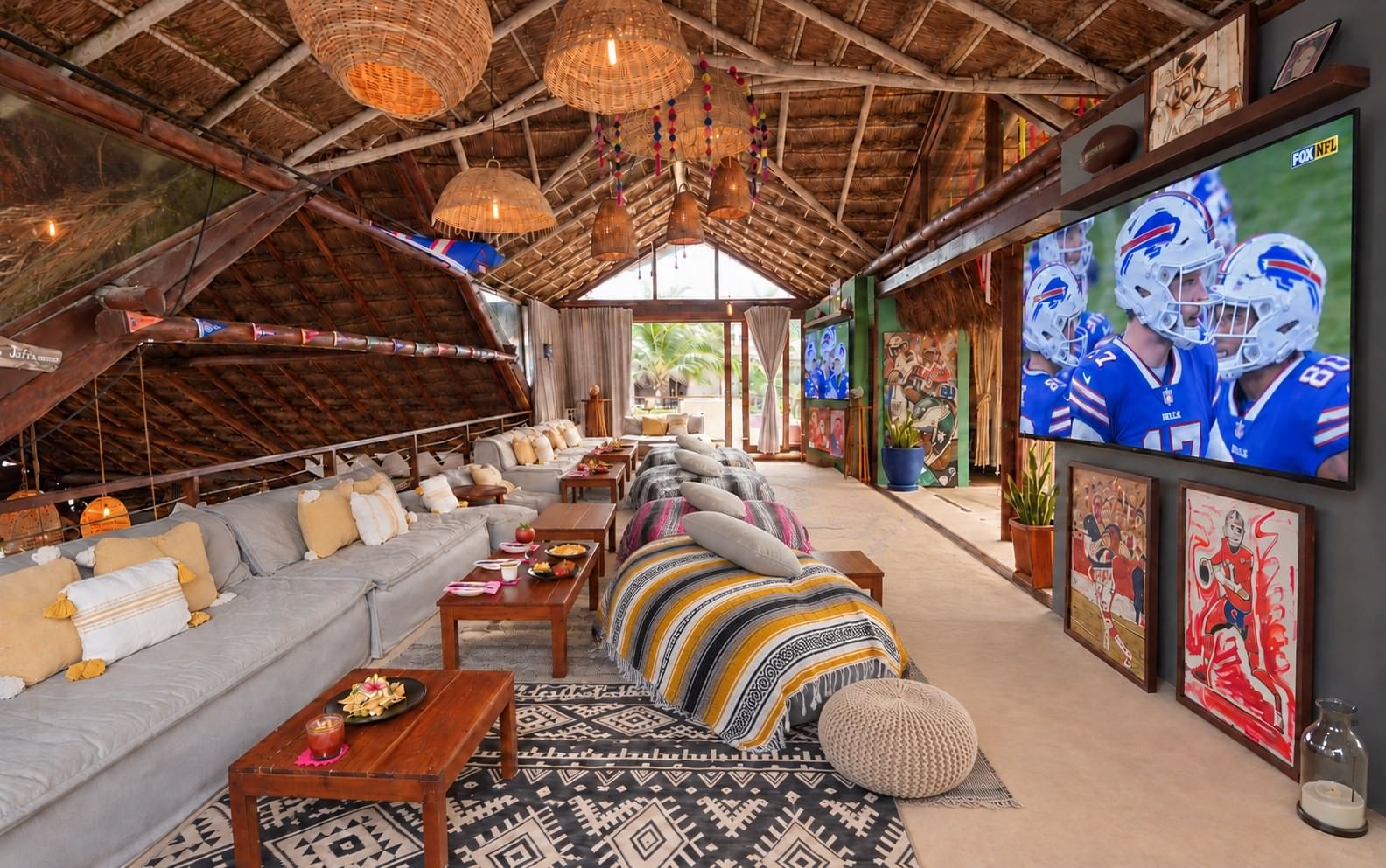 Cushioned lounge seating, low tables and football on two televisions at La Zebra’s sports bar.