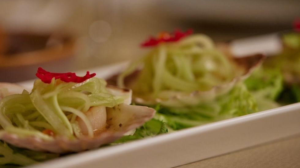 Two scallop appetizers with garnish served in Modo Mio at Crown Promenade Perth