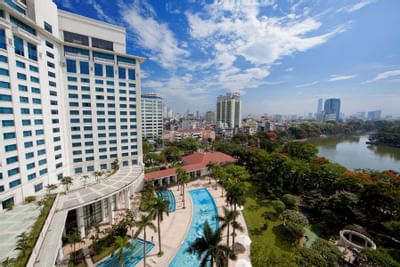 A cityscape view from a hotel pool area at Hanoi Daewoo Hotel