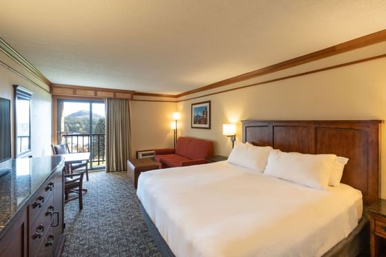Family Unit Mobility Accessible room with a comfortable bed, couch, and a balcony at Lake Placid Club Grandview
