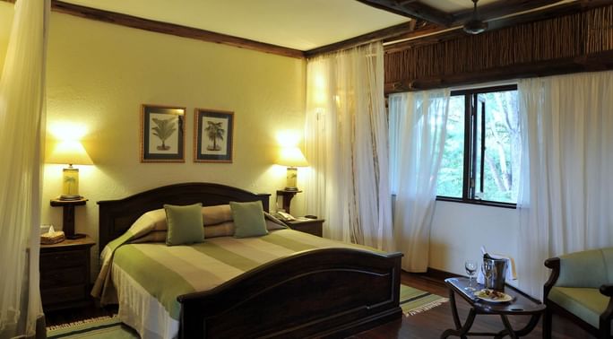 A Kings bed in Suite bedroom at Hotel Kilaguni Serena