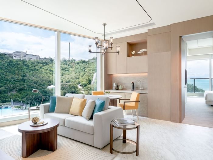 Living area with cozy sofa in Deluxe Oceanfront Balcony Suite at Fullerton Ocean Park Hotel Hong Kong