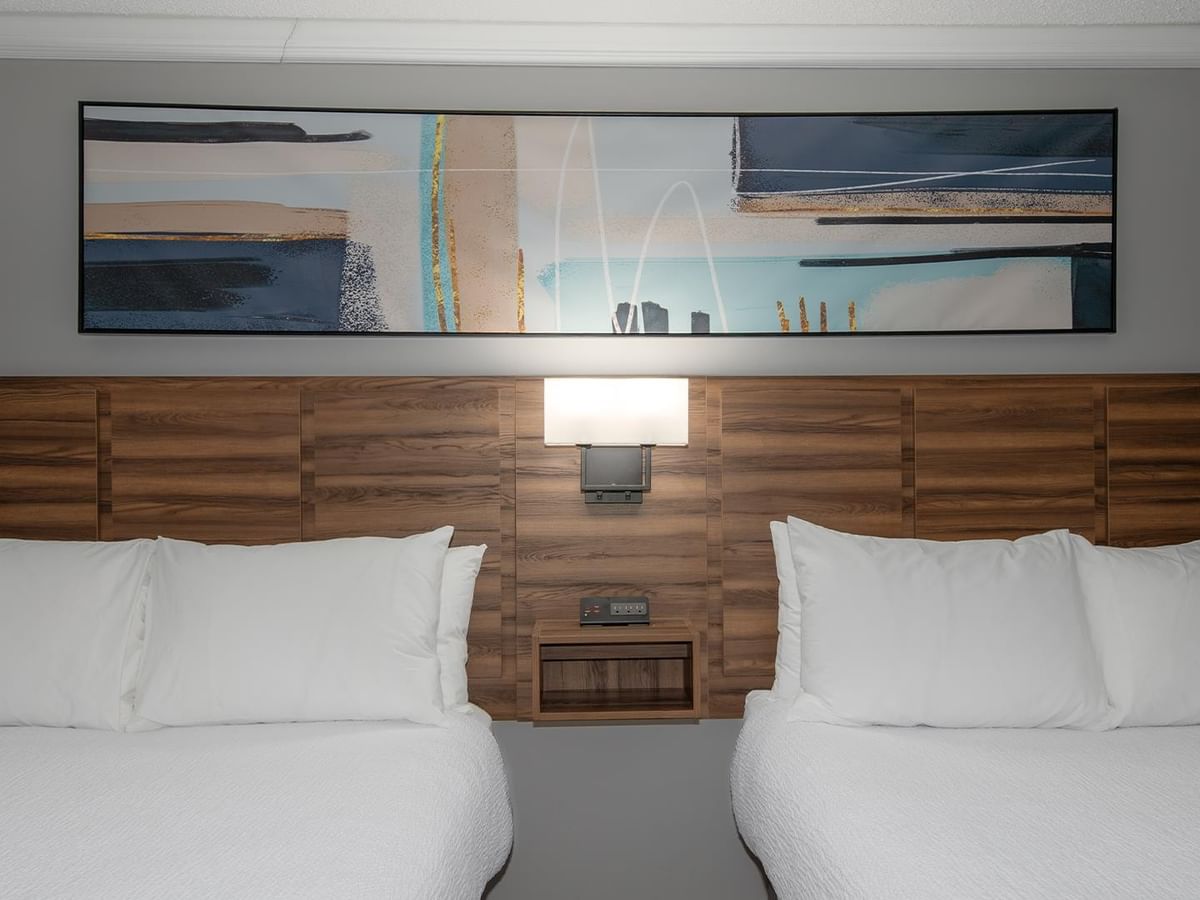 Two queen beds in a pet-friendly room.