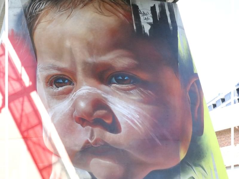 Portrait of a baby in Brisbane Street Art billboard near Pullman & Mercure Brisbane King George Square