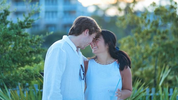 Couple sharing a tender moment outdoors for Valentine's Weekend.