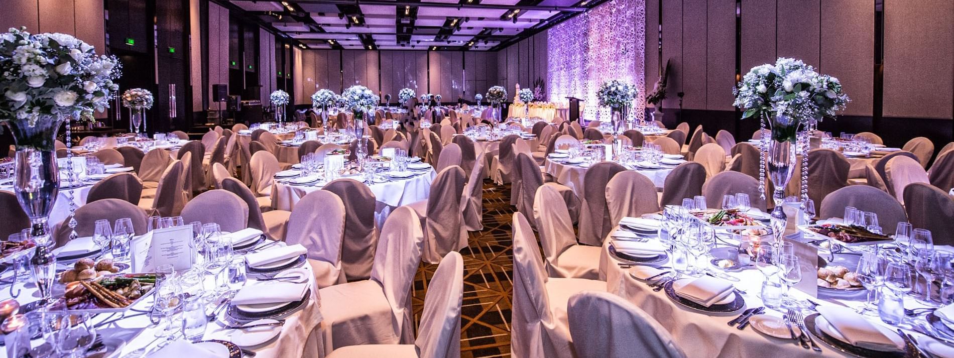 Banquet tables arranged in a hall at Crown Hotel Perth Spa