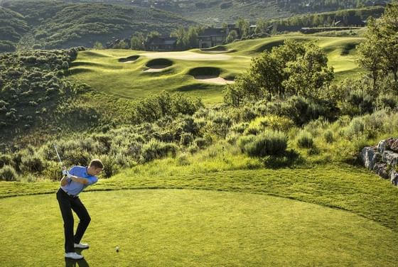 A man playing golf at Promontory Club near Stein Lodge