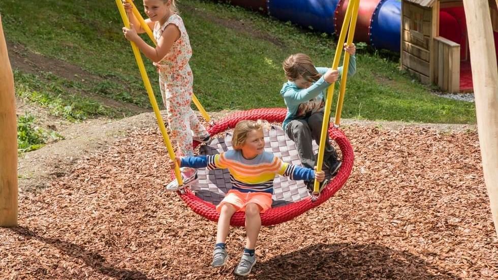 3 kids playing at an adventure park near Falkensteiner Hotels