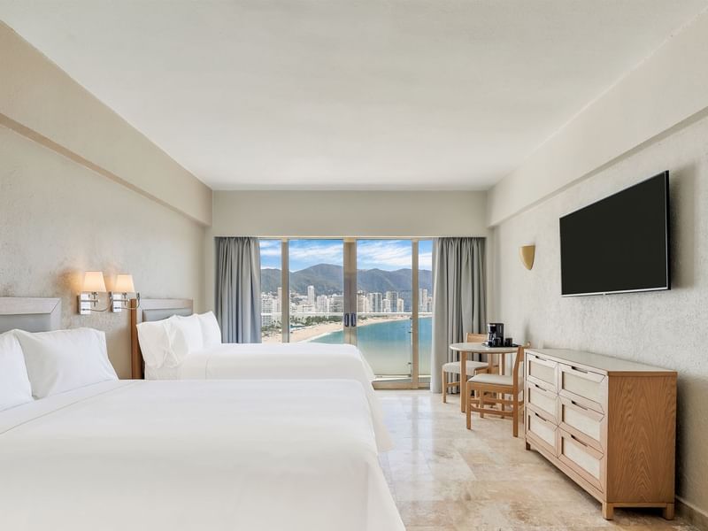 TV facing Two beds with nightstand in Deluxe Room,2 Double at Fiesta Americana Brand