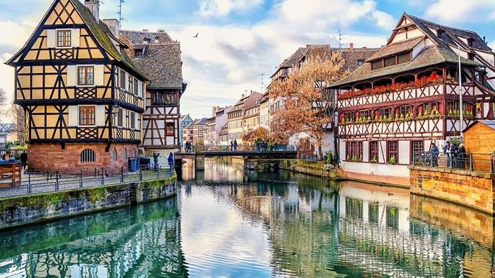 View of a canal & buildings at Strasbourg near Originals Hotels