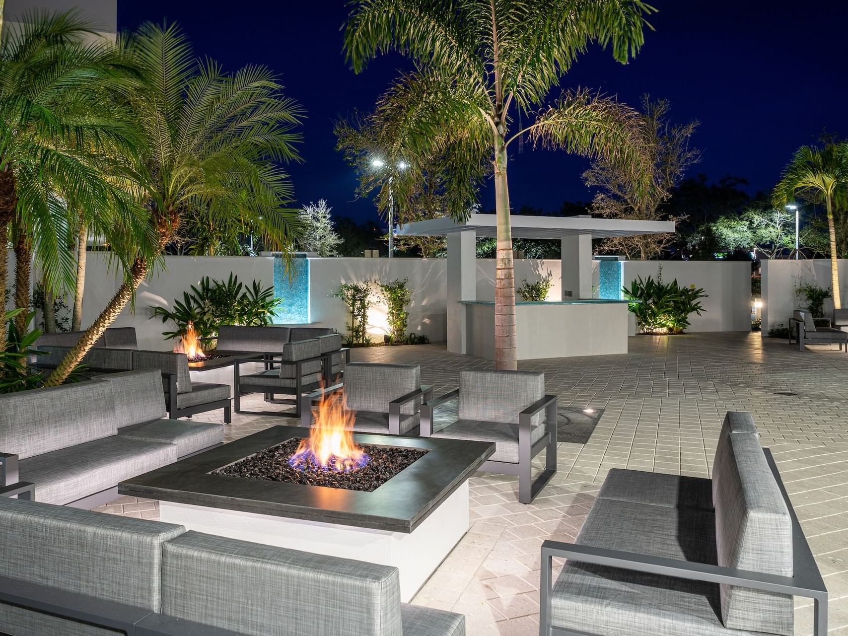 Fire-pit & seating on a patio at Innovation Hotel Courtyard