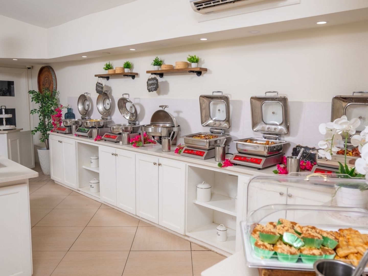 Buffet with various food options and elegant decor at Savannah Beach Hotel.