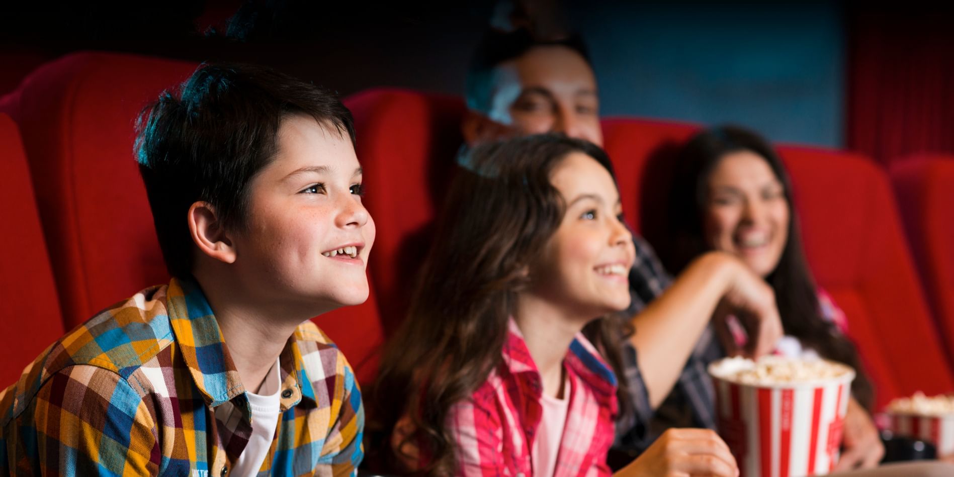 A family enjoying a movie at a cinema near Sunway Lagoon Hotel