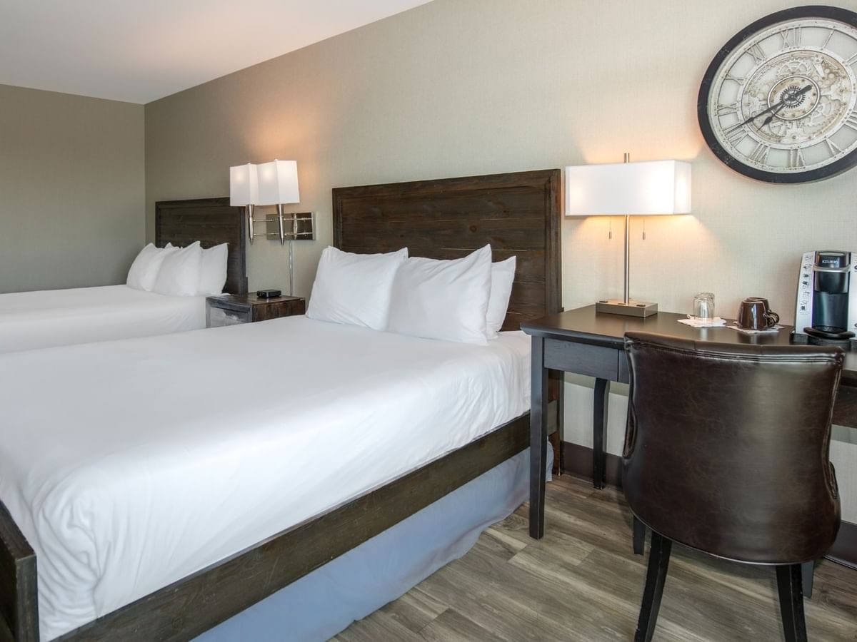 Coast Two Queens with two queen beds, a desk with a coffee maker, and a chair at Coast Lonsdale Quay Hotel