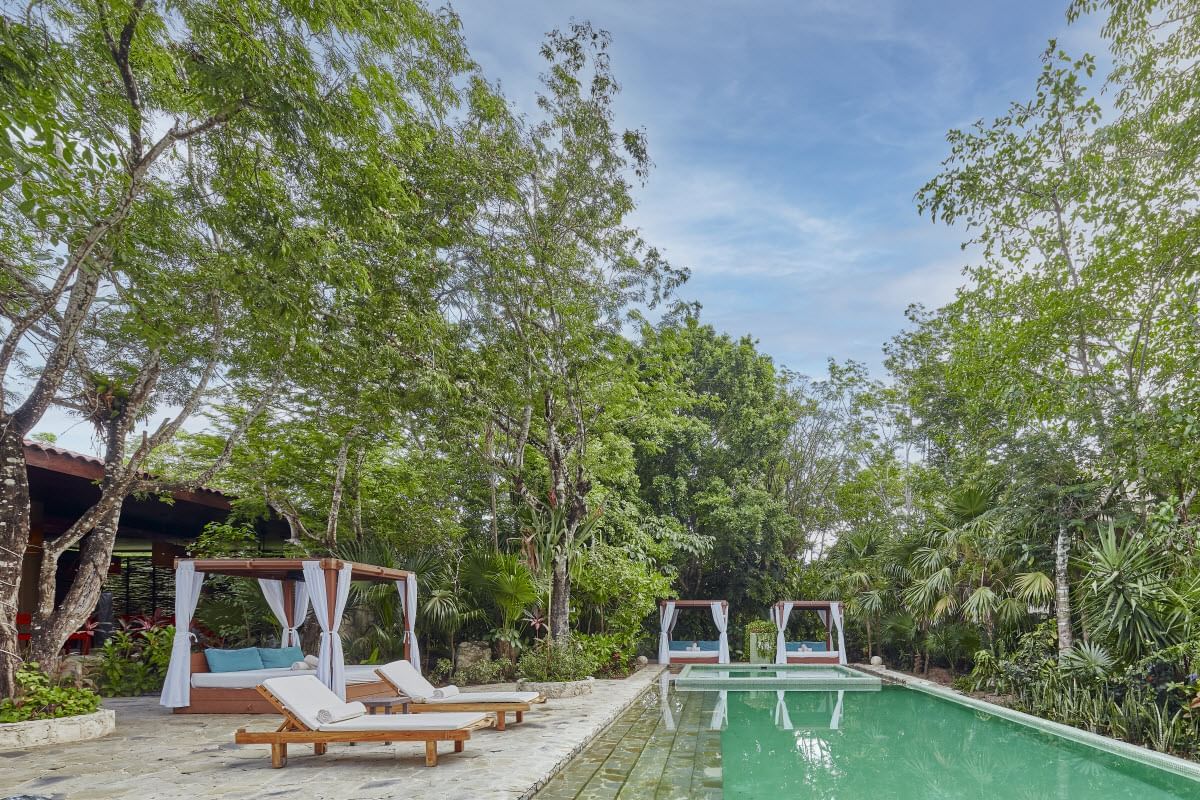 Cabana's & sunbeds by the outdoor pool area at The Explorean Cozumel