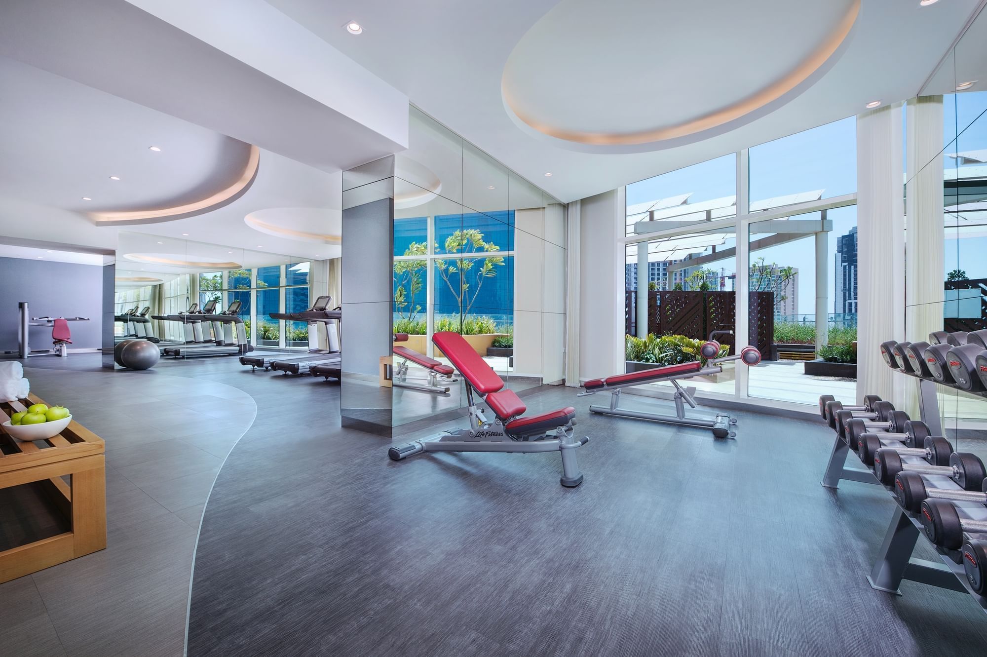 Gym with weights and machines at DAMAC Maison Distinction Hotel in Dubai