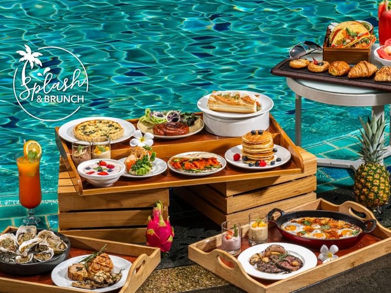 Colorful Splash & Brunch setup by the pool featuring oysters, cocktails, and varied cuisine at Sunway Resort