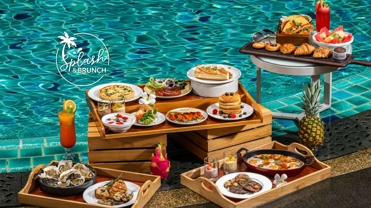 Colorful Splash & Brunch setup by the pool featuring oysters, cocktails, and varied cuisine at Sunway Resort