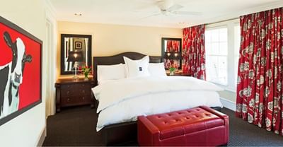 Premium Suites & Cottages with comfy bed table mirror by Inn at Willow Grove