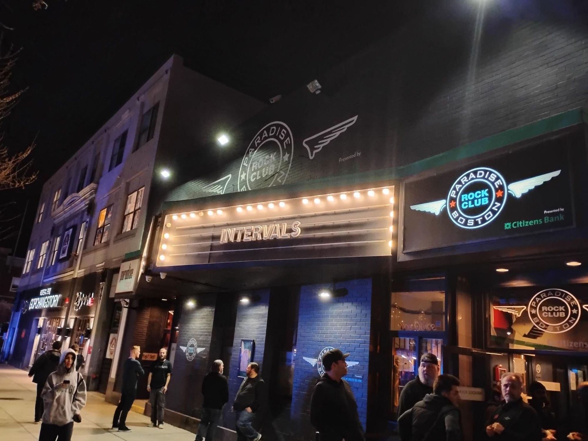 Exterior of the Paradise Rock Club at dusk with people milling about.