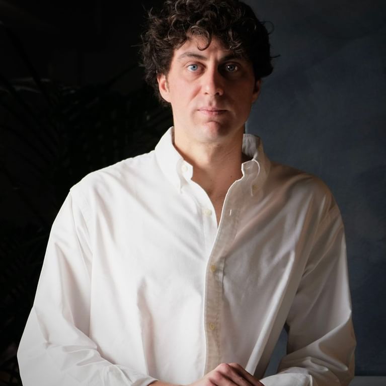 Portrait photo of a employee working in a restaurant at Rome Luxury Suites