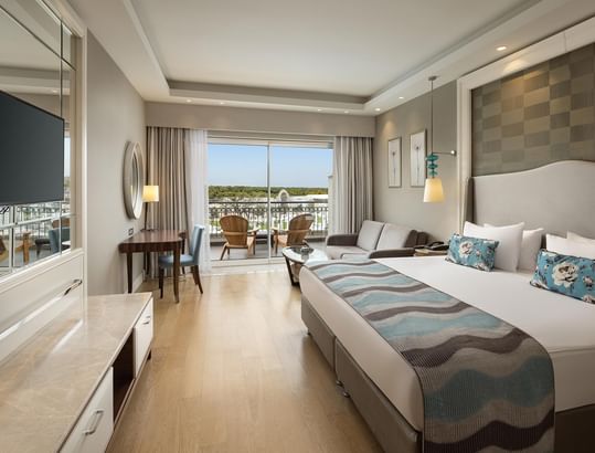 Elegant Family Suite Garden room with balcony at Titanic Deluxe Golf Belek in Antalya.