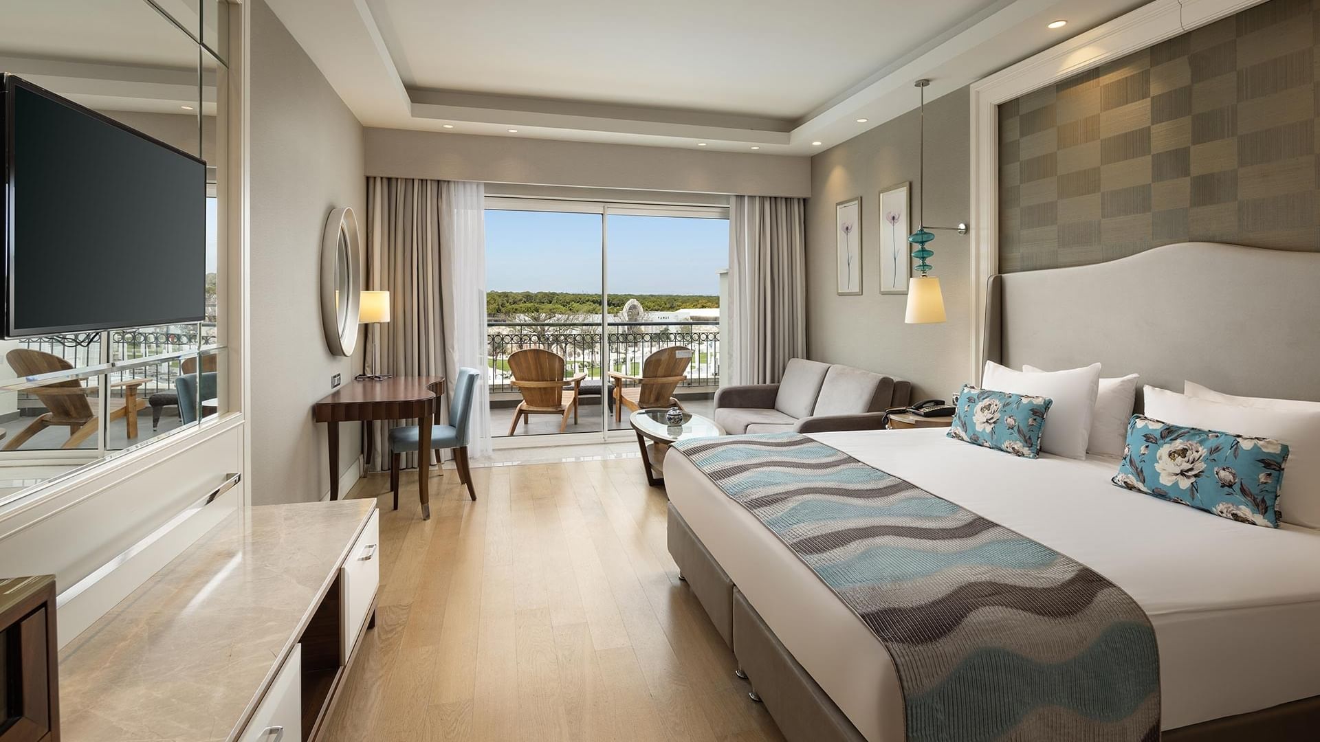 Elegant Family Suite Garden room with balcony at Titanic Deluxe Golf Belek in Antalya.