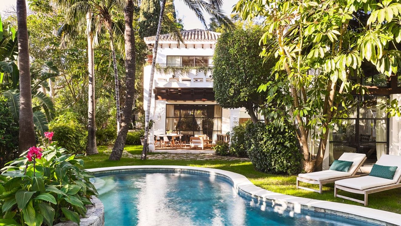Sunbeds by the outdoor pool at Bel Air at Marbella Club