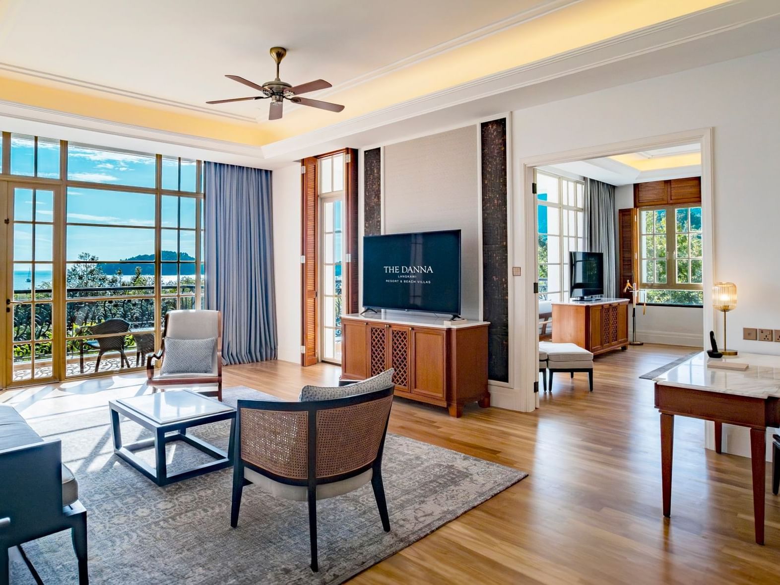 Livingroom area in Countess Sea View Suite with wooden floors at Danna Langkawi Hotel