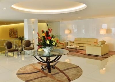 Cozy sofa set-up by lobby lounge area at Hotel Presidente Luanda