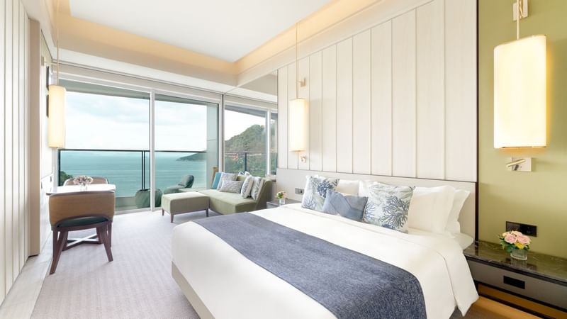 Comfy bed in Balcony Oceanfront Room at Fullerton Ocean Park