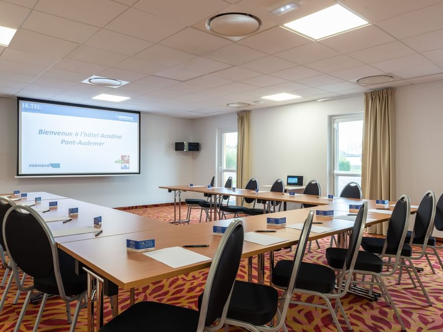 Board room arrangement with projector at Hotel Acadine