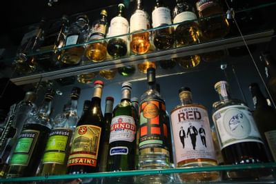 rows of bottles at a bar