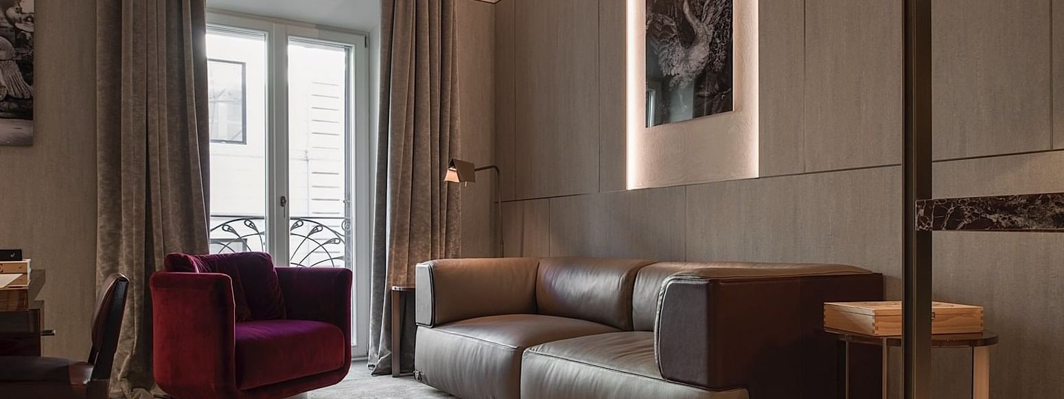 Sofa in living room in Deluxe Suite 5 at Fendi Private Suites