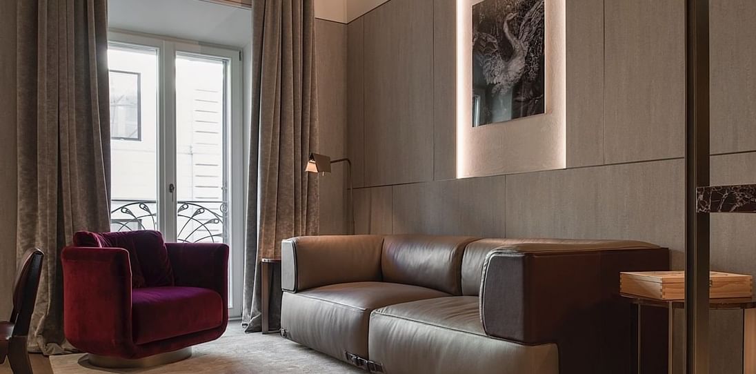 Sofa in living room in Deluxe Suite 5 at Fendi Private Suites