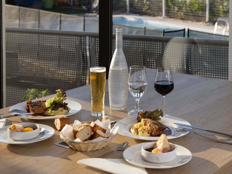 Bread & steak dishes with beer & wine at Originals Hotels