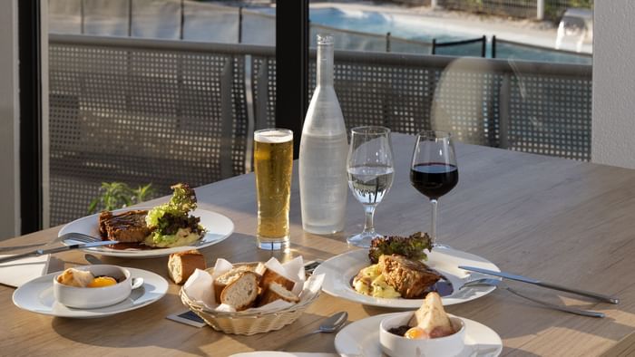 Bread & steak dishes with beer & wine at Originals Hotels