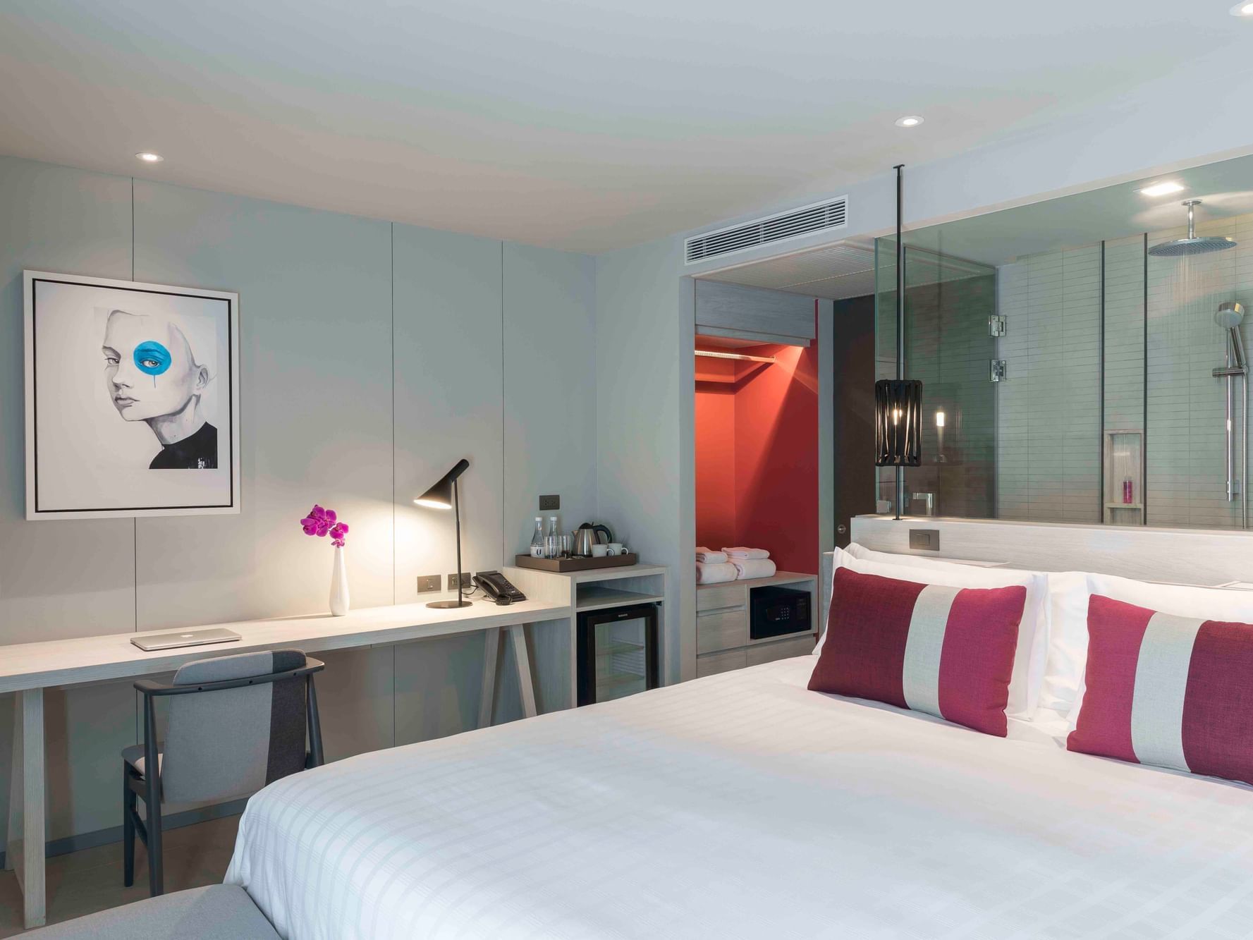 Bed and desk in Deluxe Seaview room at U Hotels and Resorts